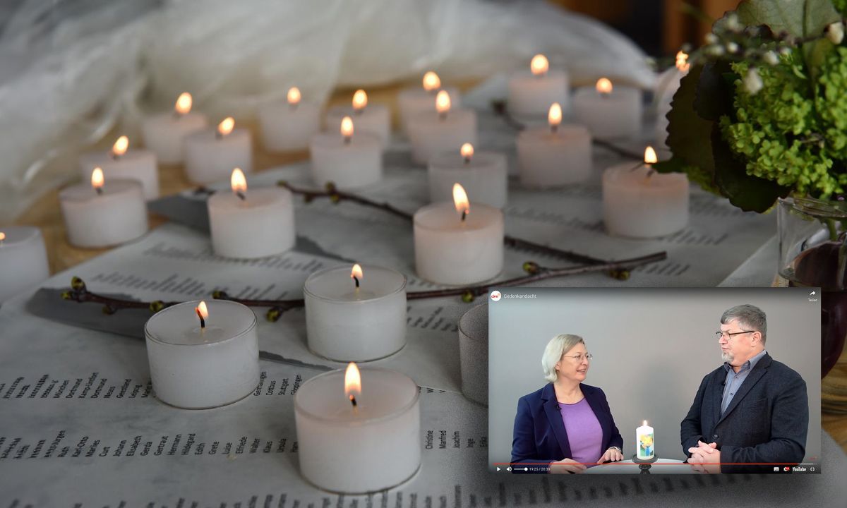 beleuchtetes buntes Glasbild mit Weltkugel und Menschen mit Behinderungen